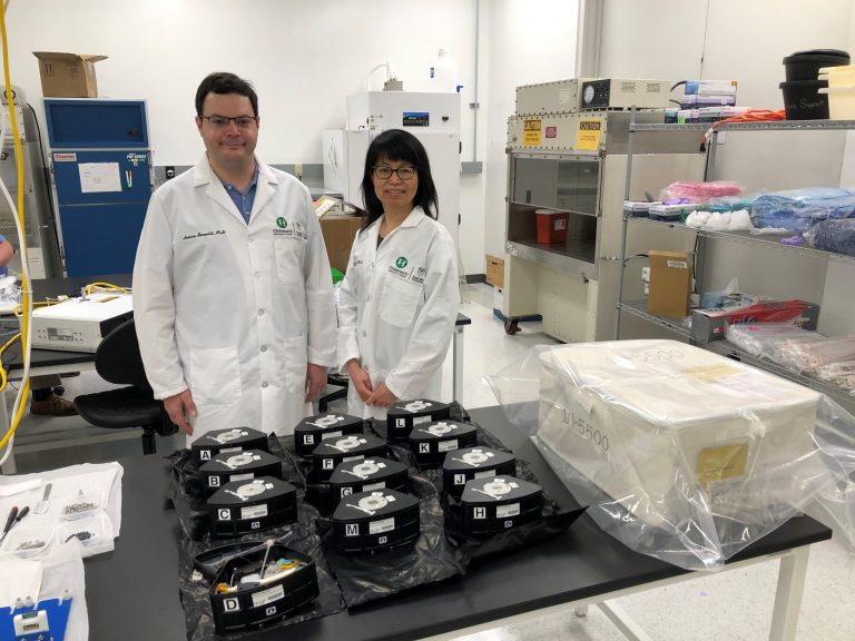 Chunhui Xu and Antonio Rampoldi, a postdoctoral fellow at Emory University, pack their cell culture hardware modules for the MVP Cell 03 investigation before launch.