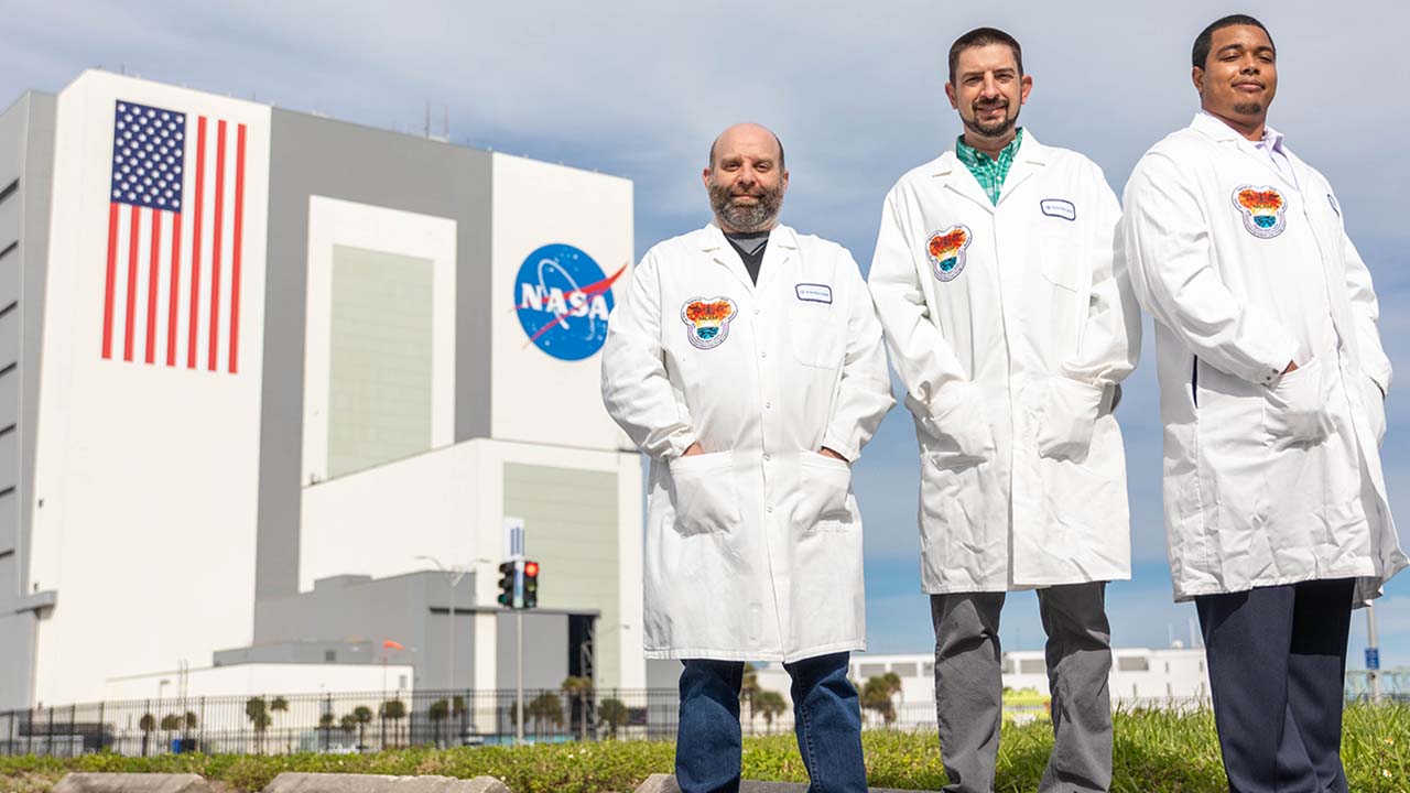 (From left) Bristol Myers Squibb researchers Matt Pokross, Robert Garmise, and Michael Little at Kennedy Space Center